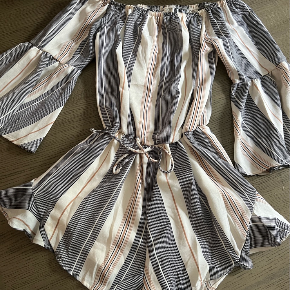 Sage strapless romper with bell sleeves and tie waste.